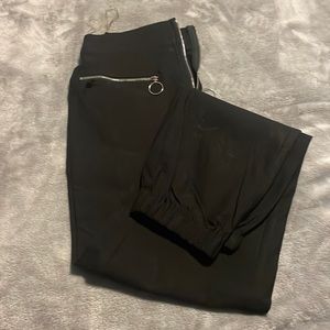 Black cargo pants with zipper pockets. Dollskill! Brand new!